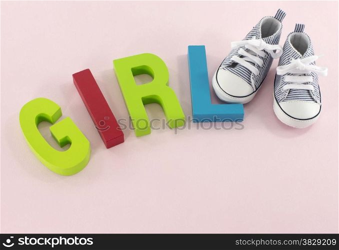 baby shoes with the letters girl