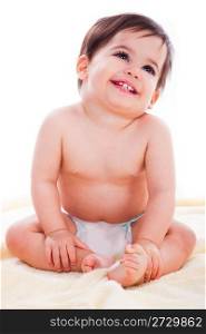 Baby sitting and smiling on white background