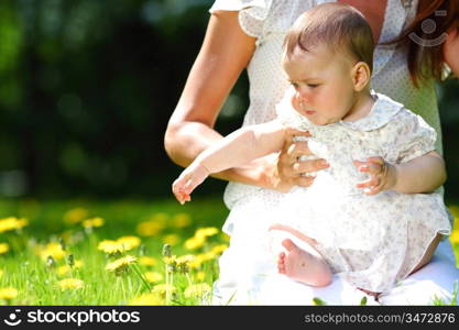 Baby sitting on mother's lap