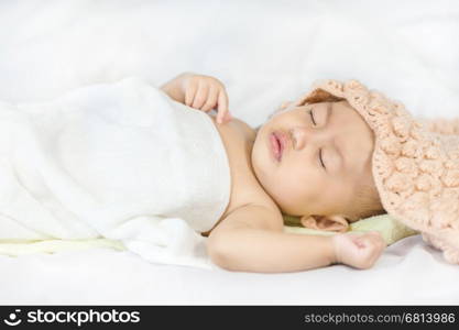 Baby sleeping on bed in the bedroom at home