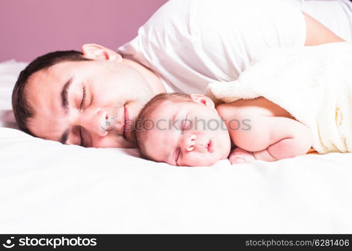Baby sleeps with dad - tender care of his father