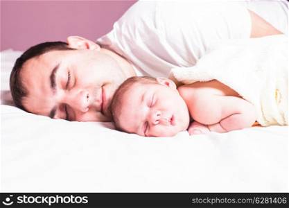 Baby sleeps with dad - tender care of his father