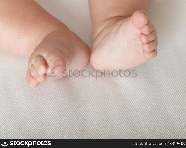 Baby small toe foot on white background