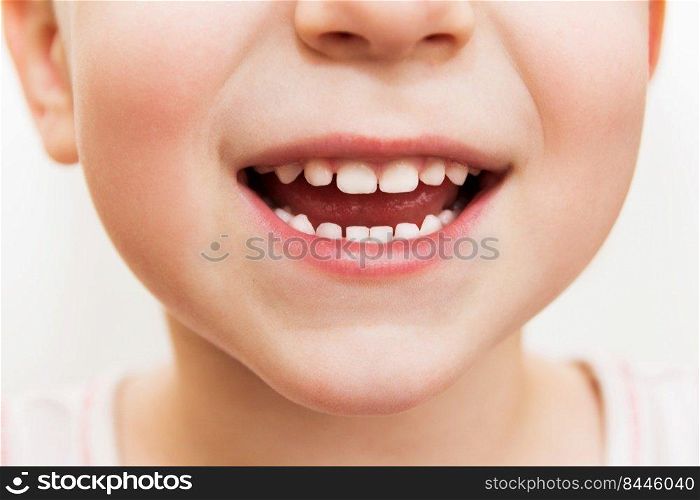 baby smile close. child teeth on a white isolated background.
