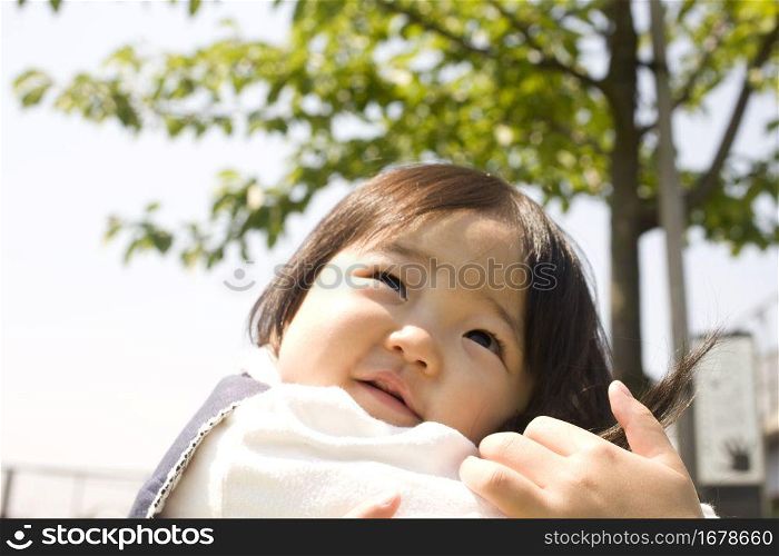 baby smiling in park