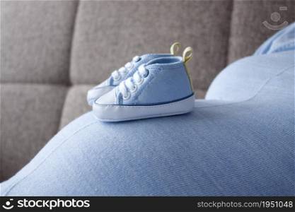 Baby sneakers in different poses / maternity period