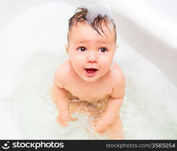 baby splashing in bath