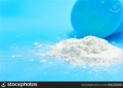 Baby talcum powder container on blue background