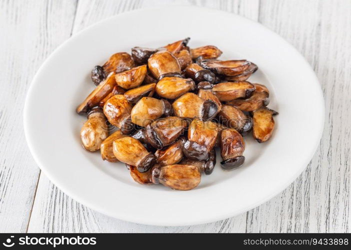 Baby teriyaki eryngii mushrooms on the plate