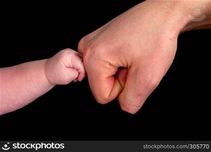 baby touching dad