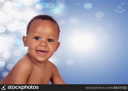 Baby with one years old doing funny gestures with surprised expression on a blue background