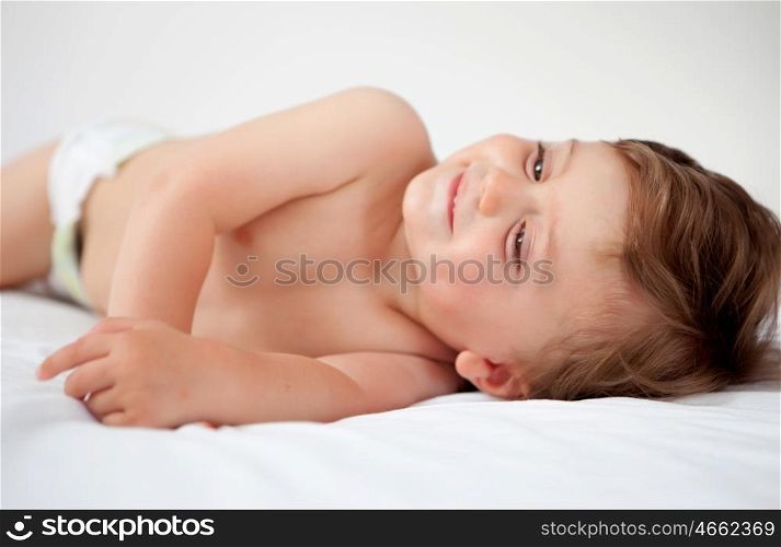 Baby with one years old getting out of bed doing gestures