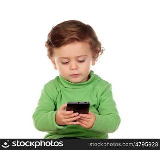 Baby with one years old playing with a mobile isolated on a white background