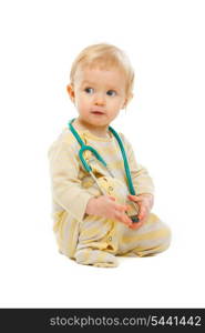Baby with stethoscope looking on side isolated on white