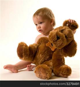 Baby with teddy bear.