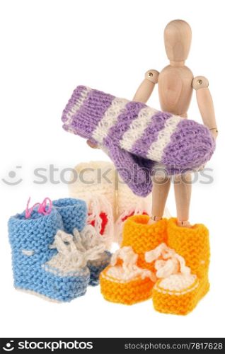 Baby wool socks and mannequin isolated on white background