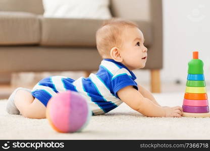 babyhood, childhood and people concept - sweet little asian baby boy playing with toy ball. sweet little asian baby boy playing with toy ball