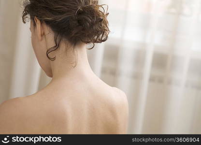 Back and shoulders of mid adult woman