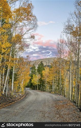 back country road in Colorado with aspen trees in fall colors - Frying Pan Road near Basalt