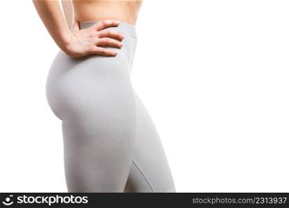 Back fashion clothing beauty concept. Gorgeous lady showing backside. Young girl in shape posing in sporty thermoactive outfit presenting exercise fashion.. Gorgeous lady showing backside.
