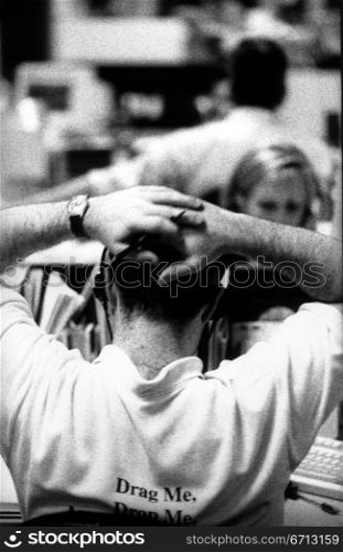 back of businessman&acute;s head with head in hands