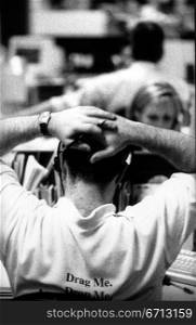back of businessman&acute;s head with head in hands