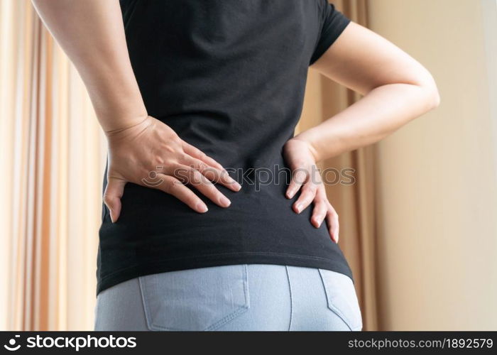 back pain at home. women suffer from backache. healthcare and medical concept