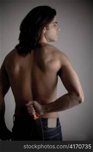 back pose of muscular man against white background