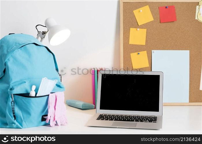 back school arrangement new normal times with laptop