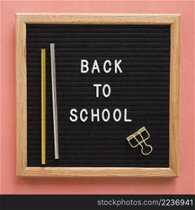 back school text slate with pencils bulldog clip colorful backdrop