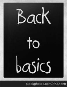 ""Back to basics" handwritten with white chalk on a blackboard"