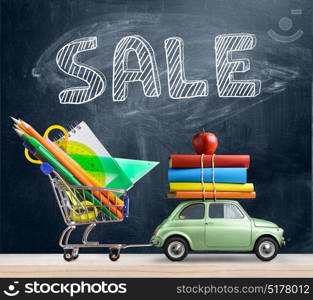 Back to school car.. Back to school sale background. Car delivering shopping cart with accessories, books and apple against blackboard.