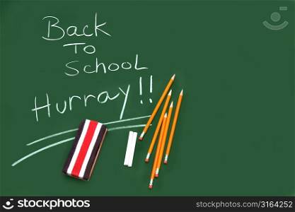 Back to school chalkboard with stationary