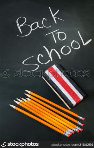 Back to school chalkboard with stationary