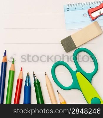 Back to school children accessories on striped notepad