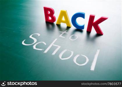 Back to school, colorful words on blackboard.