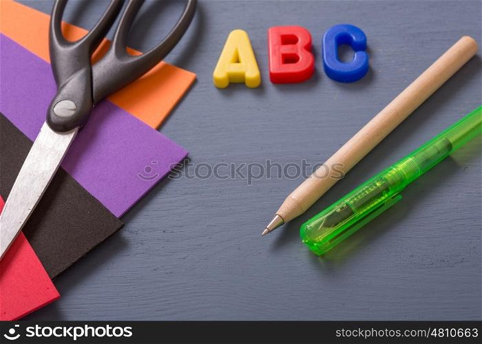 Back to school concept on a blue wooden background