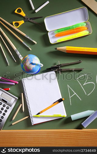 back to school concept with ABC written in school in green color blackboard