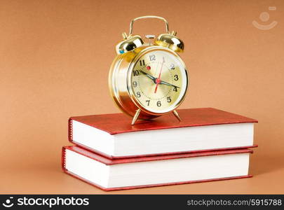 Back to school concept with books and clock