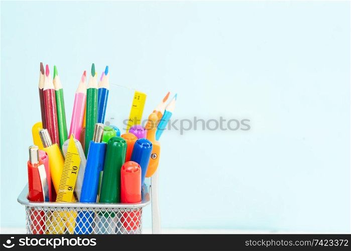 Back to school concept with school supplies close up on blue background with copy space. back to school
