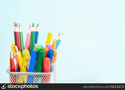 Back to school concept with school supplies close up on blue background with copy space. back to school