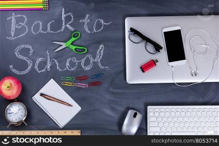 Back to school concept with traditional supplies on left side and modern technologies on right side of image.