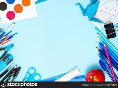 Back to School Conceptl: Notebook and School Supplies. Notebook, Apple, Bookmark, Pen, Pencils, Scissors, Felt Pens, Marker on the Blue Background. Frame in Blue, Red, Black and White Colors.