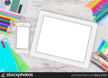 back to school hero header with school supplies on wooden table, copy space on blank screen of tablet and phone. back to school frame