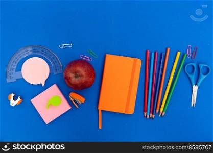 Back to school new normal concept with school supplies on classic blue background. back to school