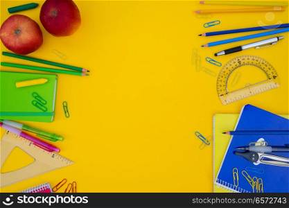 back to school styed flat lay borders with school supplies on yellow. back to school