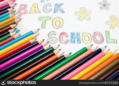 " "Back to school" text and color pencils"