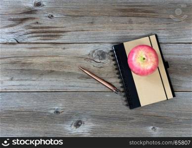 Back to School traditional items on rustic desktop in flat layout view