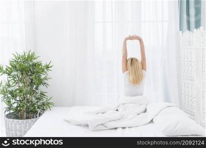 back view adult woman waking up home
