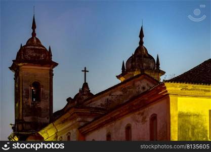 Back view at night of old and historic church in colonial architecture from the 18th century in the city of Ouro Preto in Minas Gerais, Brazil. Back view of old and historic church in colonial architecture from the 18th century